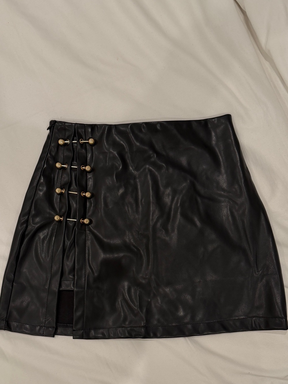Black Faux Leather Mini Skirt with Gold Bar Detail